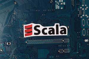Scala programming language logo over electronic circuit board background