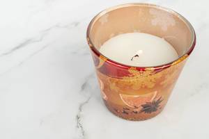 Scented Candle on the white marble table