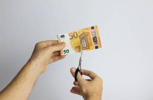 Scissors cut Euro banknote