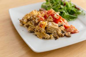Scrambled eggs with tofu, tomatoes and mushrooms and sald