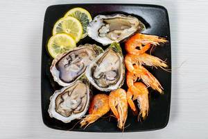 Sea delicacies-shrimp and oysters. Top view (Flip 2019)