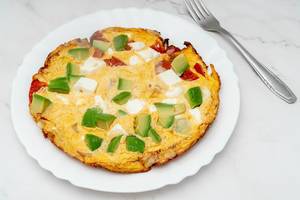 Served Omelet with Avocado Cheese and Tomatoes (Flip 2019)