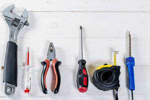Set of different tools for repair and construction: pliers, screwdriver, tape measure, wrench