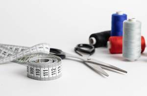 Sewing kit with measuring tape, scissors and spool