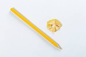 Sharpened yellow pencil on white background (Flip 2019)