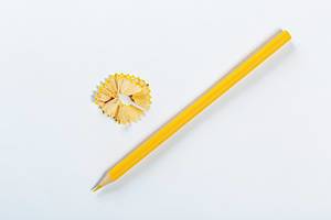 Sharpened yellow pencil on white background
