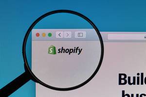 Shopify logo under magnifying glass