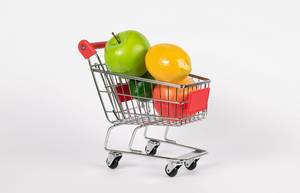Shopping cart filled with fresh fruit