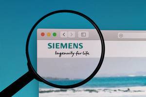 Siemens logo under magnifying glass