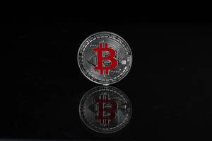 Silver Bitcoin on a black background