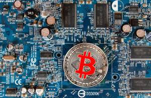 SIlver Bitcoin on a computer mother board