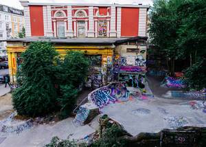 Skateboard court covered in street art