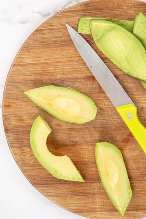Sliced Avocado on the wooden board