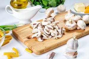 Sliced champignons on the kitchen board (Flip 2019)