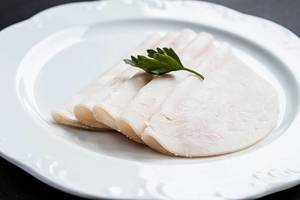 Sliced ham with fresh green lettuce leave
