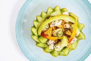 Sliced Melon and Peach with Chia seeds on the plate