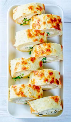 Sliced omelet stuffed with cheese and herbs