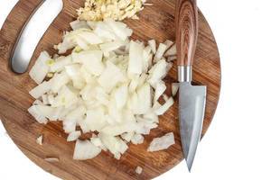 Sliced Onions with Garlic on the wooden cutting board (Flip 2019)