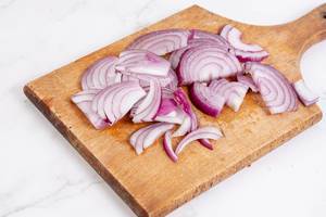 Sliced Red Onions on the wooden board