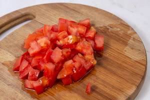 Sliced Tomato on the round wooden board (Flip 2019)