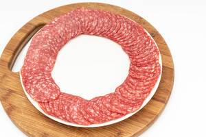 Smoked red Sausage arranged on the plate (Flip 2019)