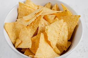 Snack time - Tortilla chips in white bowl
