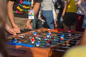 Soccer fans playing table football