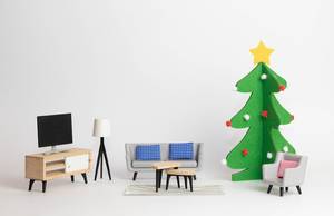 Sofa beside a Christmas tree