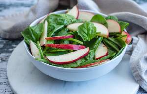 Spinach and Apple Salad in a White Bowl (Flip 2019) (Flip 2019)