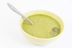Spinach Soup served in the bowl above white background
