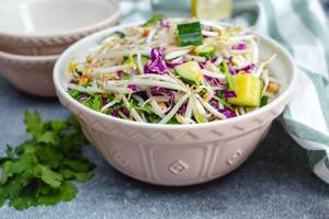 Sprout Asian Salad with Cucumber and fresh herb in a bowl  (Flip 2019)