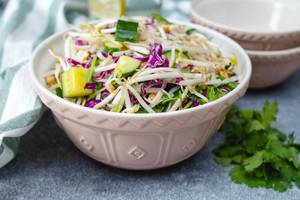 Sprout Asian Salad with Cucumber and fresh herb in a bowl