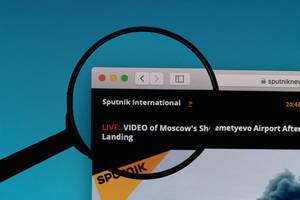 Sputnik International website under magnifying glass