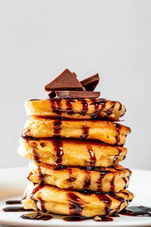Stack of pancakes with chocolate closeup