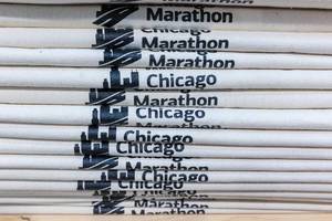 Stack of promotional items for Chicago City Marathon