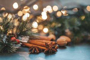 Star anise, cinnamon and nutmeg on Christmas night background with Golden bokeh (Flip 2019)