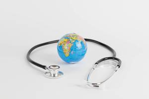 Stethoscope and a globe symbolizes "Rescue the world"