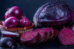 Still life with fresh purple vegetables. Healthy eating concept