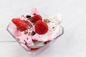 Strawberry Ice Cream in the bowl with fresh strawberries