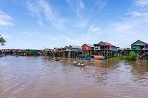 Students on Boats passing Kampong Phluk Floating Village in Cambodia