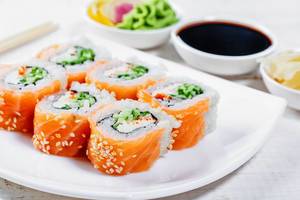 Sushi philadelphia with sauce, ginger and wasabi