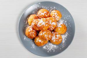 Sweet balls deep fried sprinkled with powdered sugar