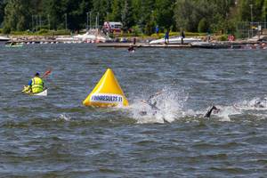 Swimming competition of professional athletes during the Ironman 70.3 Triathlon in Lahti, Finland