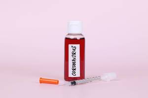 Syringe with Coronavirus blood test tube