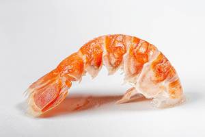 Tail of a boiled lobster on a white background close-up (Flip 2020)