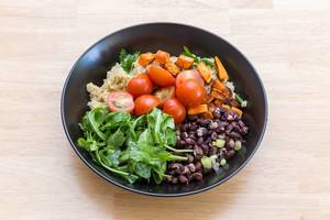 Tasty and healthy: sweet potatoes, cherry tomatoes, rocket and red beans