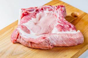 Tasty raw veal meat on wooden cutting board