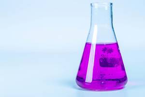 Test flask with purple liquid on light background (Flip 2020)