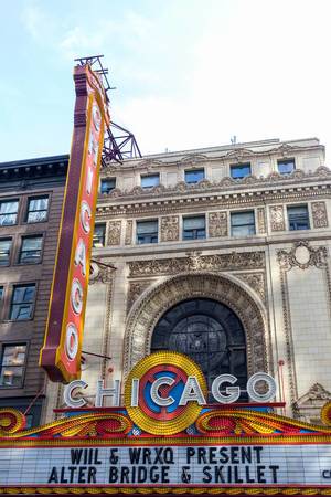 The large colorful sign and the famous marquee on the front side of the building of the Chicago landmark theater in The Loop