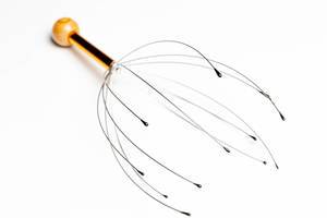 The manual head massager on white background (Flip 2020)